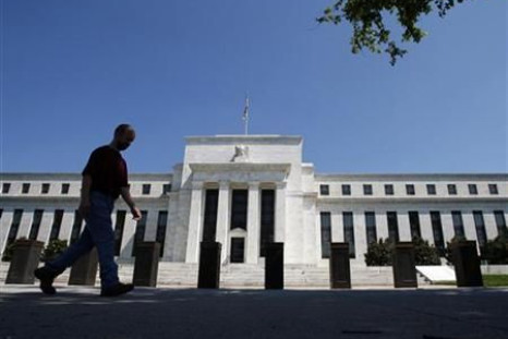 A man walks in front of the U.S. Federal Reserve building in Washington