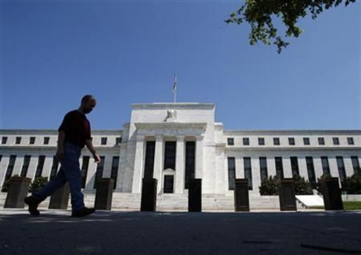 A man walks in front of the U.S. Federal Reserve building in Washington