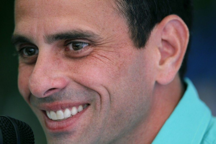 Opposition frontrunner presidential candidate Henrique Capriles Radonski speaks to the foreign media in Caracas