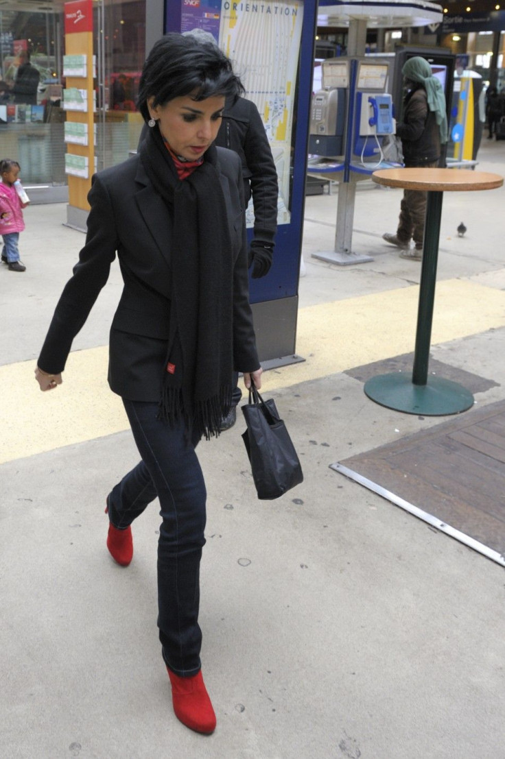 Former French Justice Minister Rachida Dati walks in the Gare du Nord train station to take a train for Lille.