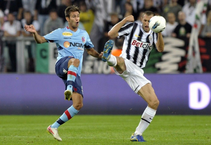 Gaston Ramirez of Bologna challenges Juventus' Giorgio Chiellin during their Serie A soccer match at the Juventus Stadium in Turin