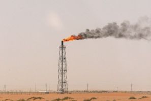 A gas flame is seen in the desert near the Khurais oilfield, about 160 km (99 miles) from Riyadh, June 23, 2008.