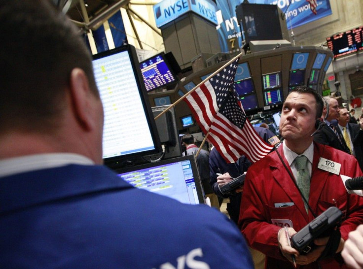 Traders work on the floor of the New York Stock Exchange February 24, 2012.