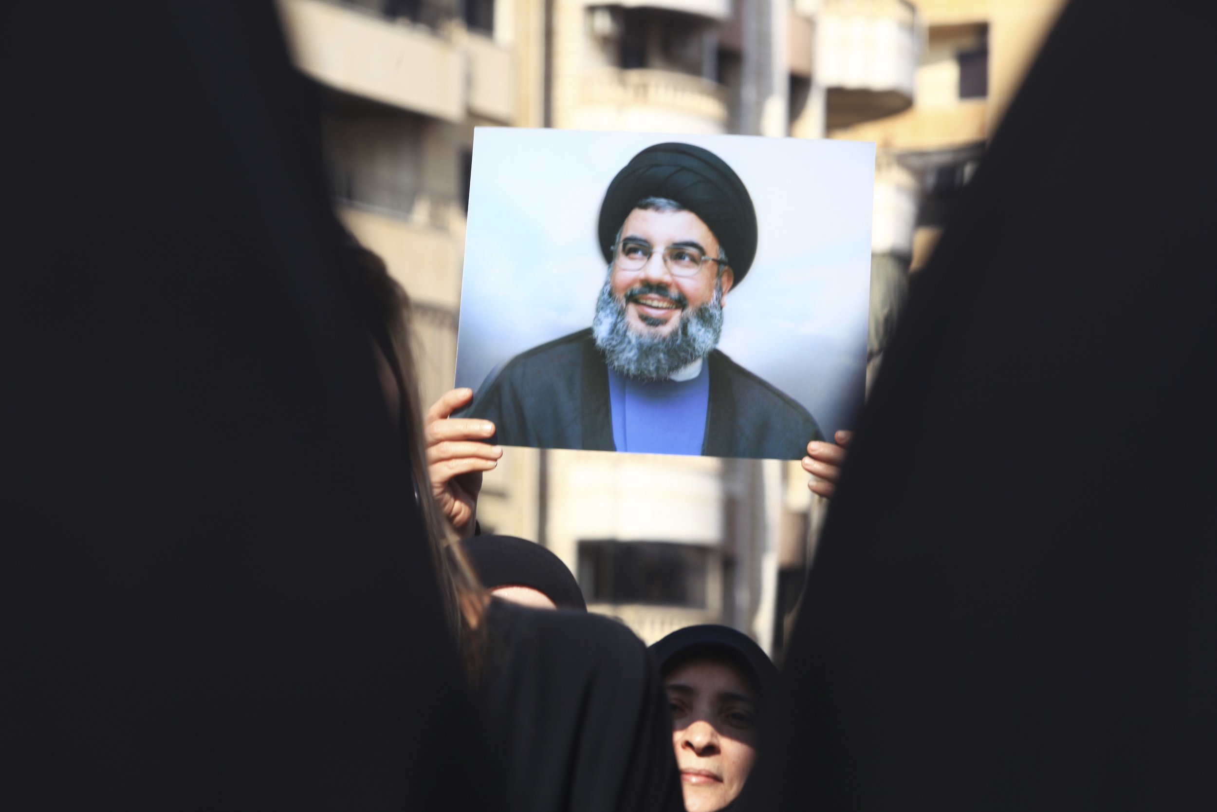Supporter with a picture of Hassan Nasrallah