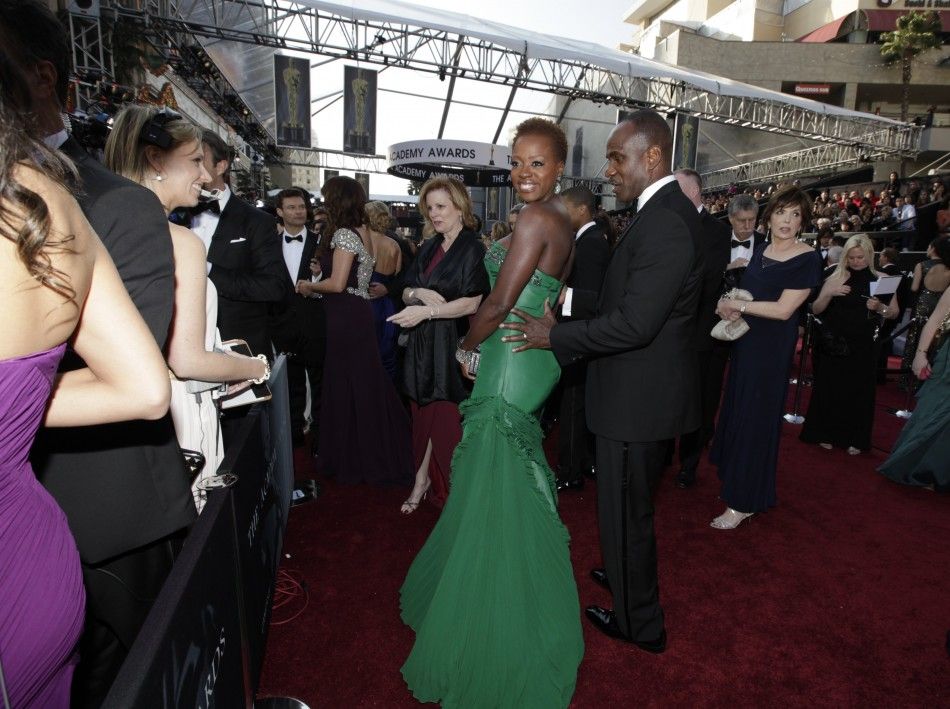 Viola Davis, best actress nominee for her role in quotThe Helpquot, and her husband Julius Tennon arrive at the 84th Academy Awards