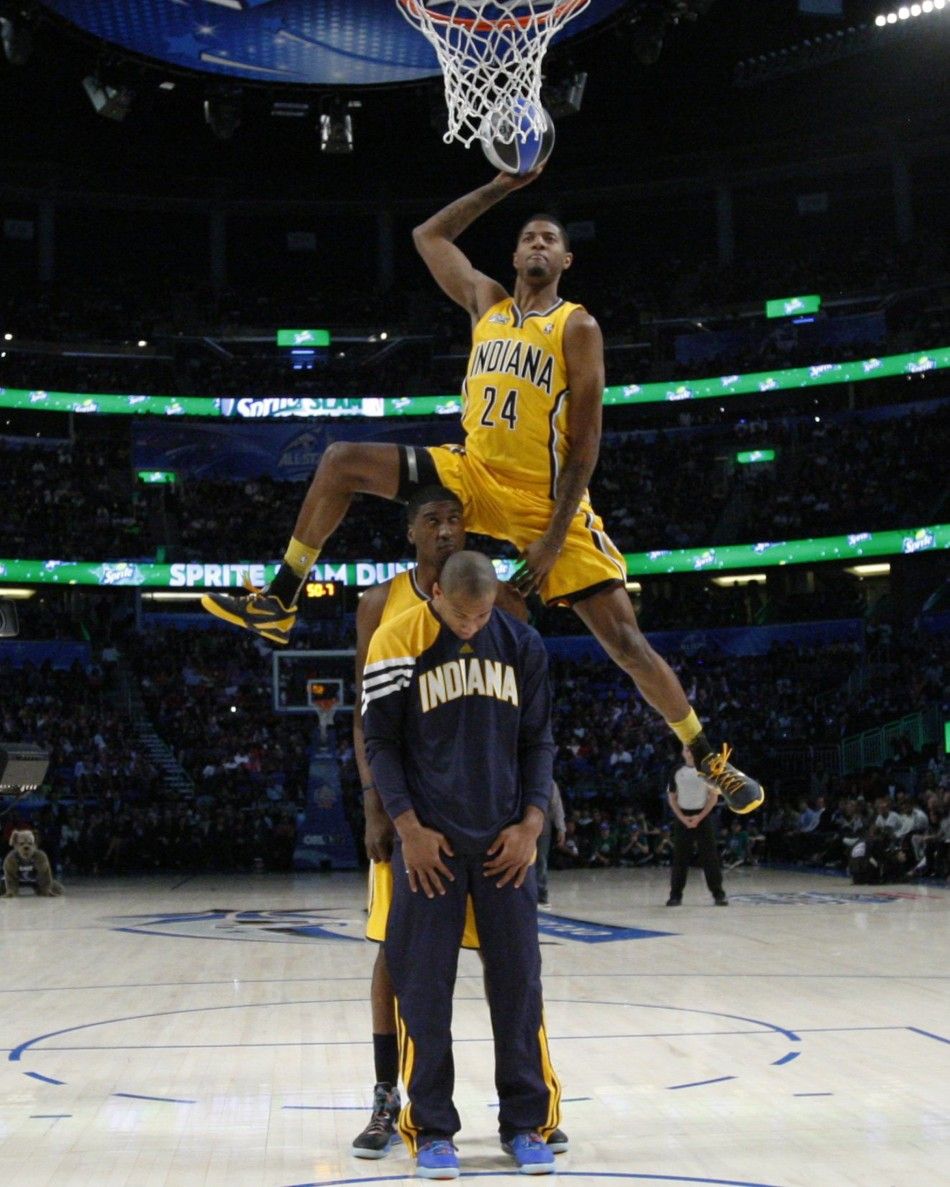 Pacers Paul George jumps over teammates
