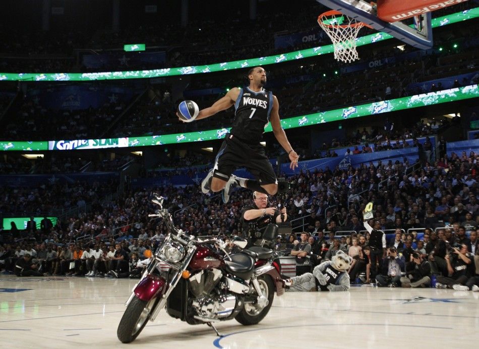 Timberwolves Williams dunks over a motorcycle while competing in the slam dunk contest during the NBA All-Star weekend in Orlando