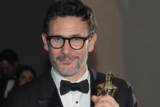 French Director, Hazanavicius, winner of best director for his film &quot;The Artist&quot; smiles with his Oscar statuette during the Governors Ball following the 84th Academy Awards in Hollywood