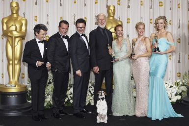 Producer Langmann, Dujardin, director Hazanavicius, Cromwell, Bejo, Miller and Pyle hold their Oscars after winning best picture for &quot;The Artist&quot; backstage at the 84th Academy Awards in Hollywood
