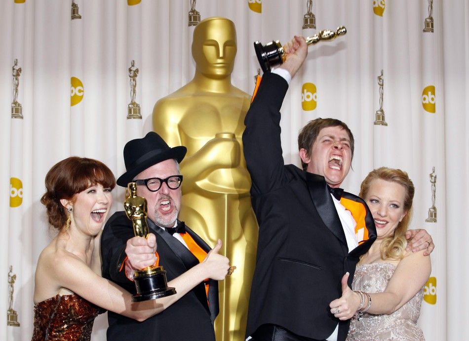 William Joyce and Brandon Oldenburg, winners of Best Animated Short Film, celebrate with their awards backstage during the 84th Academy Awards in Hollywood