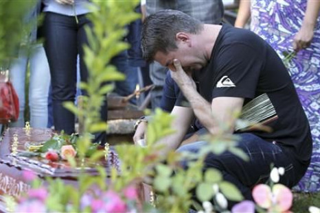 Mourning father outside Brazil fire