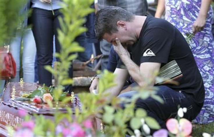 Mourning father outside Brazil fire