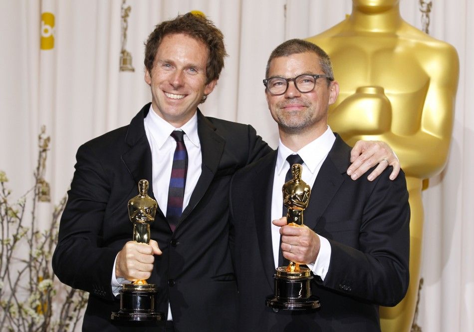 Baxter and Wall, winners of Film Editing award for film quotThe Girl with the Dragon Tattooquot, pose at 84th Academy Awards in Hollywood