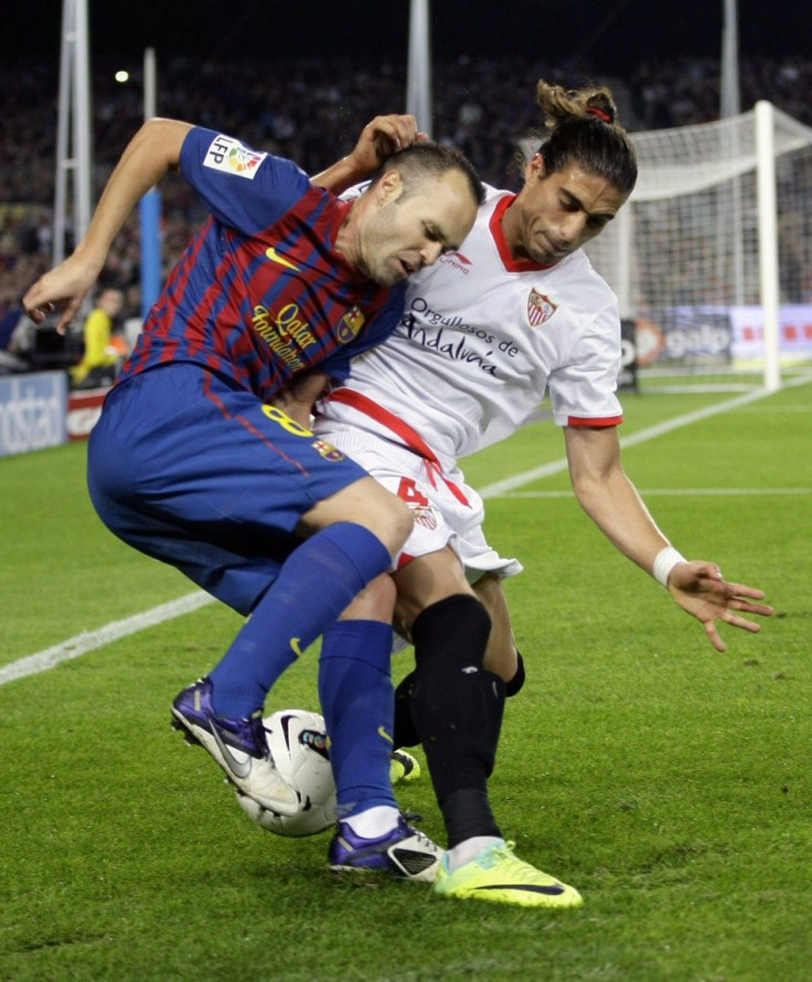 Martin Caceres (R), here battling with Barcelona&#039;s Andres Iniesta, could be set for a move to Manchester United, according to reports