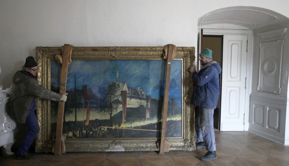 Workers move a 1943 painting by German painter Eichhorst at the Doksany Monastery near Prague