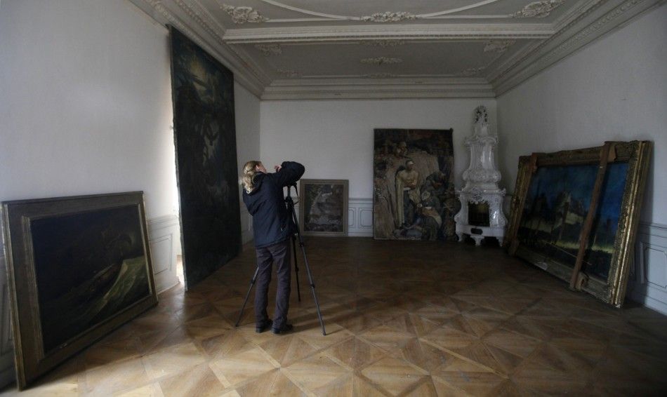 A photographer takes pictures of paintings at the Doksany Monastery near Prague