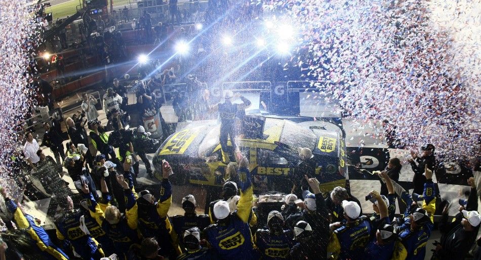 Kenseth celebrates atop of his number 17 Ford after he won in the rain delayed NASCAR Sprint Cup Series Daytona 500 race at the Daytona International Speedway in Daytona Beach
