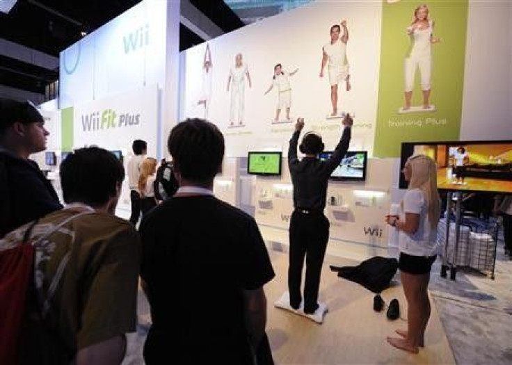 Attendees play Wii Fit Plus at the E3 Electronic Entertainment Expo in Los Angeles June 2, 2009.
