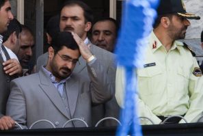 File photo shows Tehran Prosecutor General Saeed Mortazavi adjusting his hair as he attends an execution by hanging in Tehran