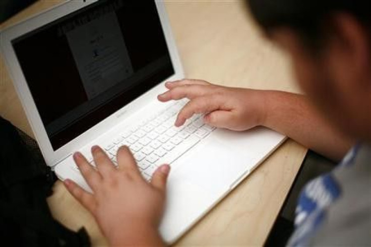 A high school student uses a laptop in a file photo. A high school student uses a laptop in a file photo.