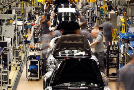 Workers assemble the new Porsche 911 sports car at the Porsche factory in Stuttgart-Zuffenhausen