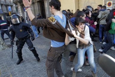 Police charge protesters during anti-austerity demonstrations in Barcelona
