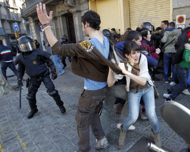 Police charge protesters during anti-austerity demonstrations in Barcelona