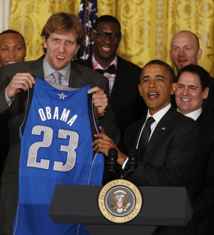 U.S. President Obama receives jersey from 2011 NBA champions Dallas Mavericks at the White House in Washington