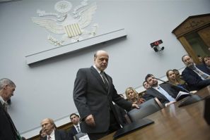 Bernanke takes his seat to testify about monetary policy before the House Financial Services on Capitol Hill in Washington