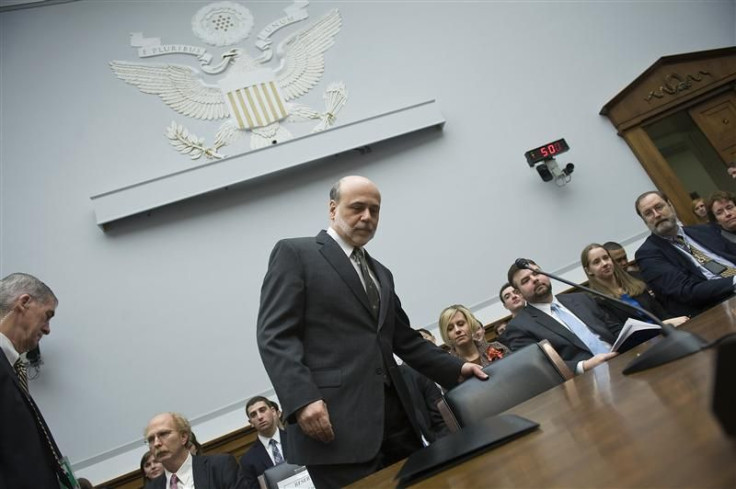 Bernanke takes his seat to testify about monetary policy before the House Financial Services on Capitol Hill in Washington