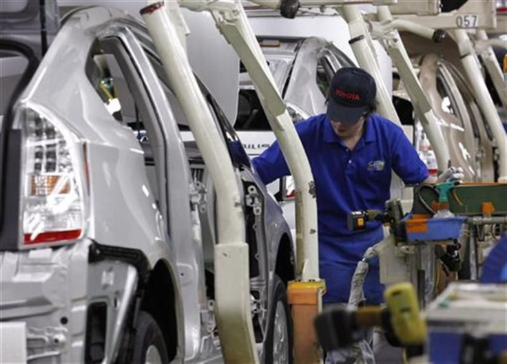 An employee works on an assembly line of Toyota Motor Corp's hybrid car &quot;Prius&quot; at Tsutsumi plant in Toyota Dec. 9 2011