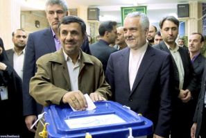 Iranian President Ahmadinejad casts his vote at a mosque, used as a polling station, during the parliamentary election in Tehran