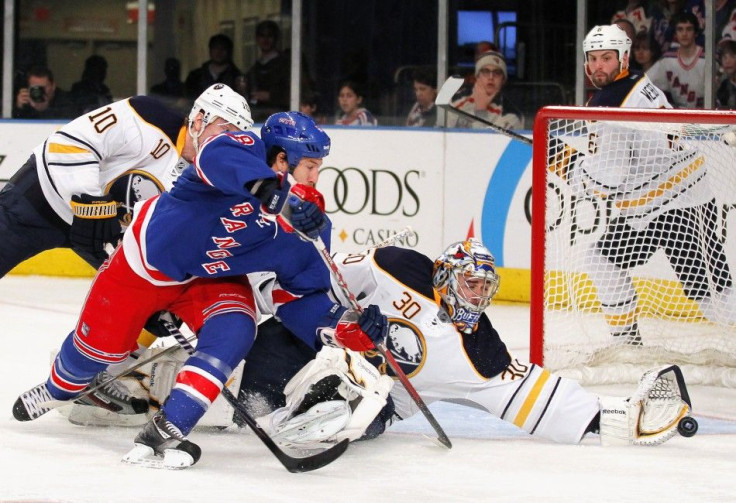 Ryan Miller stretches for a glove save. The Sabres goaltender has become a force over the past two weeks.