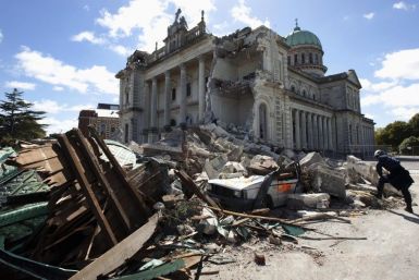 A rescue worker looking through the rubble of the Cathedral of Blessed Sacrament in Christchurch.