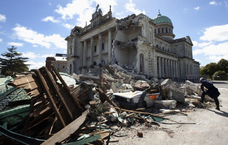 A rescue worker looking through the rubble of the Cathedral of Blessed Sacrament in Christchurch.