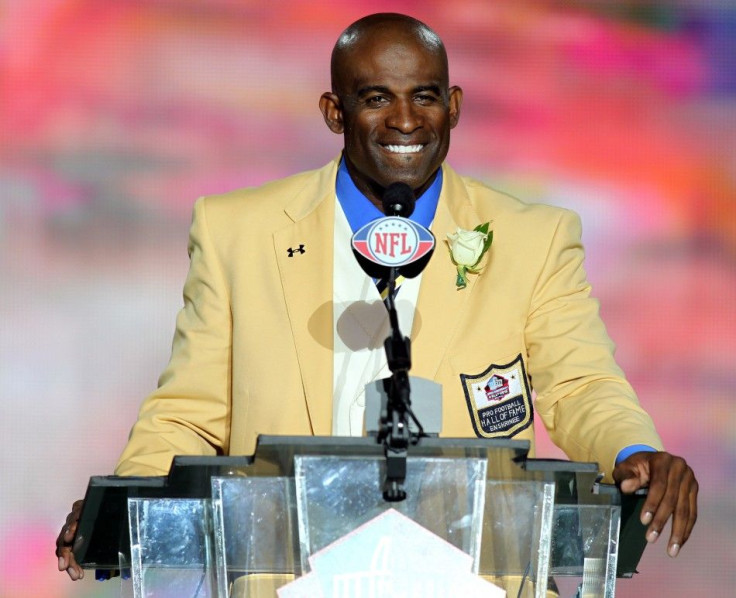 Former Dallas Cowboy Deion Sanders delivers his acceptance speech during his induction into the NFL Pro Football Hall of Fame in Canton