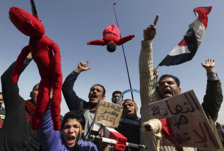 Relatives of victims killed during the revolution shout slogans against former Egyptian president Mubarak and Field Marshal Tantawi in Cairo.