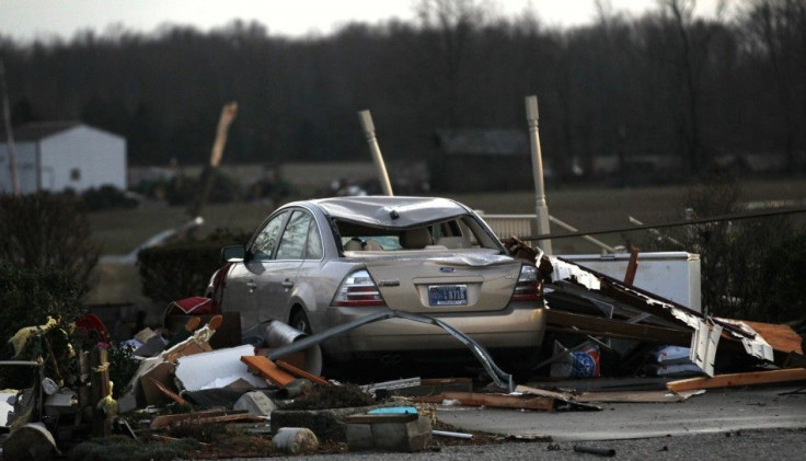 Residents work to clear storm damage after three tornadoes moved through the area in Chelsea, Indiana March 2, 2012.