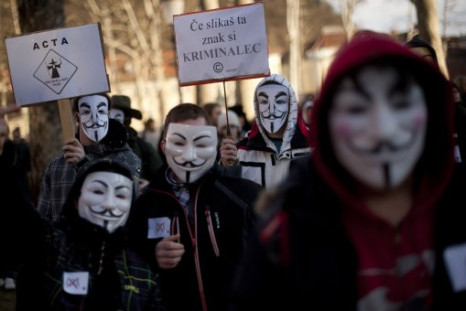 Internet rights activists wearing &quot;Anonymous&quot; masks attend an anti-ACTA protest in downtown Ljubljana, Slovenia