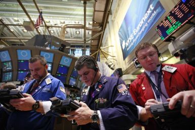 Traders work on the floor of the New York Stock Exchange, February 28, 2012.