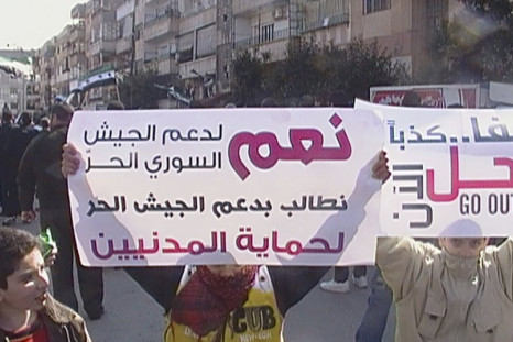 Demonstrators protest against Syria&#039;s President Bashar al-Assad after Friday prayers at Al Qusour in Homs March 2, 2012.