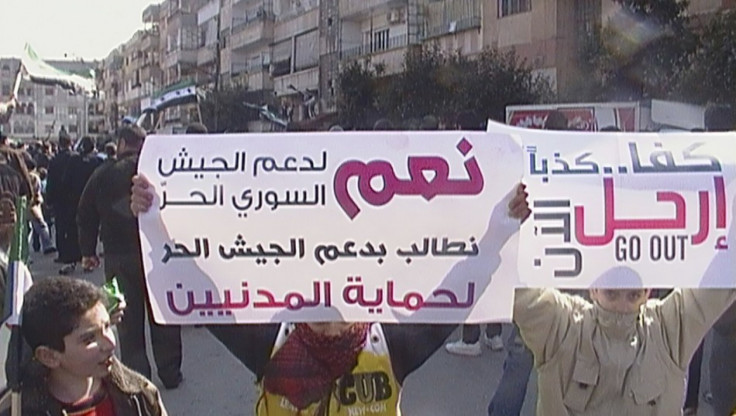 Demonstrators protest against Syria&#039;s President Bashar al-Assad after Friday prayers at Al Qusour in Homs March 2, 2012.