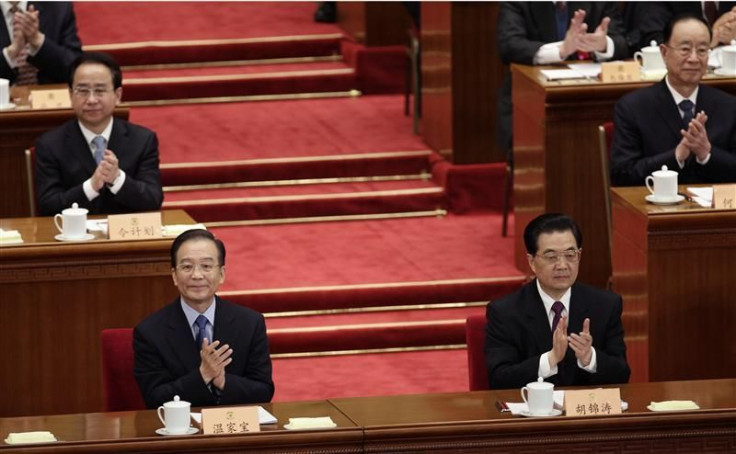 China&#039;s President Hu and Premier Wen clap during the opening ceremony of the Chinese People&#039;s Political Consultative Conference in Beijing