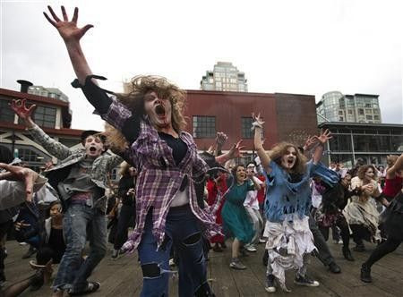 People dressed as Zombies dance to Michael Jackson's ''Thriller'' in downtown Vancouver, British Columbia October 23, 2010.