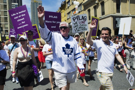 Maple Leaf&#039;s General Manager Brian Burke marches in the Toronto Gay Pride Parade in support of his son Brendan.