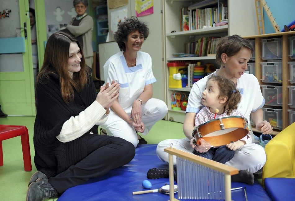 Carla Bruni-Sarkozy Visits Disabled Children at a Motor Rehabilitation Center 