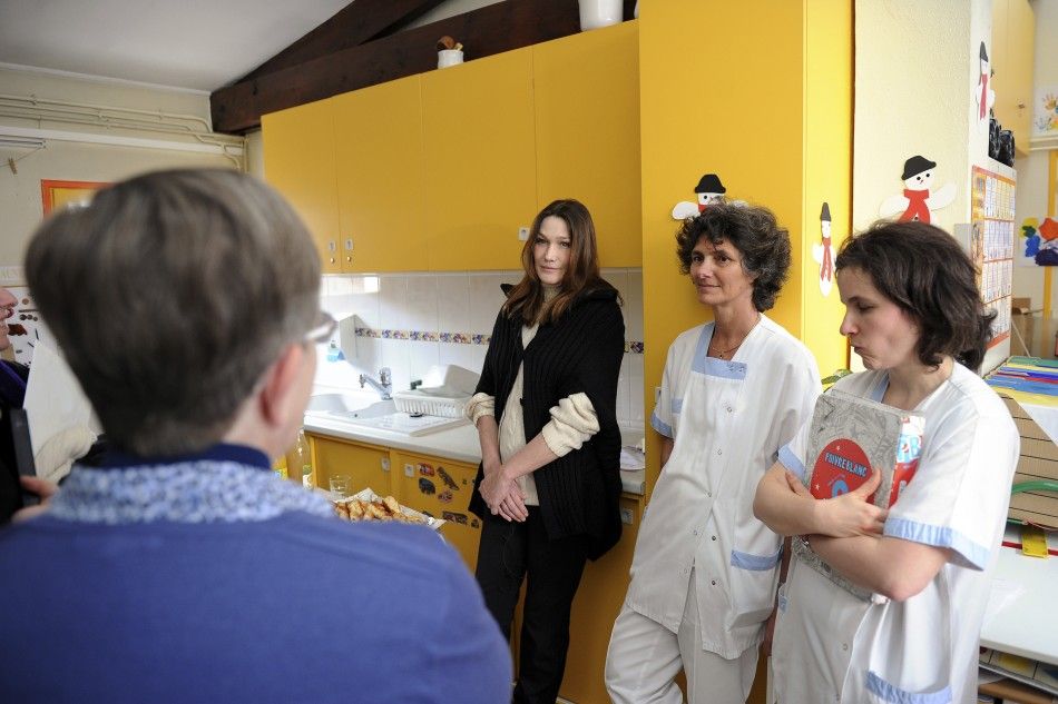 Carla Bruni-Sarkozy Visits Disabled Children at a Motor Rehabilitation Center 