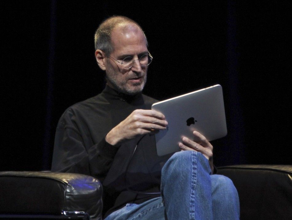 Apple CEO Steve Jobs with new tablet computer during launch in San Francisco