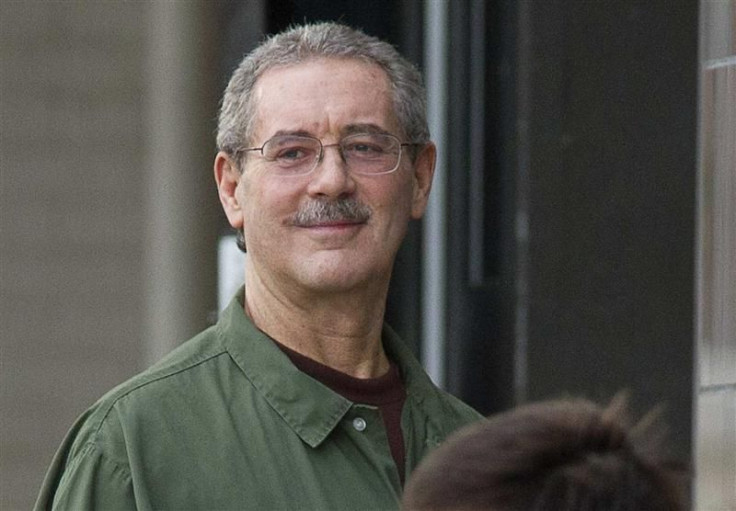 Allen Stanford smiles as he waits to enter the Federal Courthouse where the jury was deliberating in his criminal trial in Houston