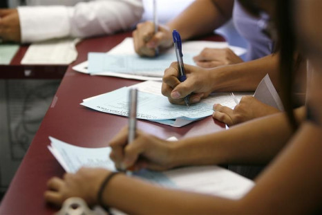 Applicants Fill Out Forms During a Job Fair at the Southeast LA-Crenshaw WorkSource Center in Los Angeles